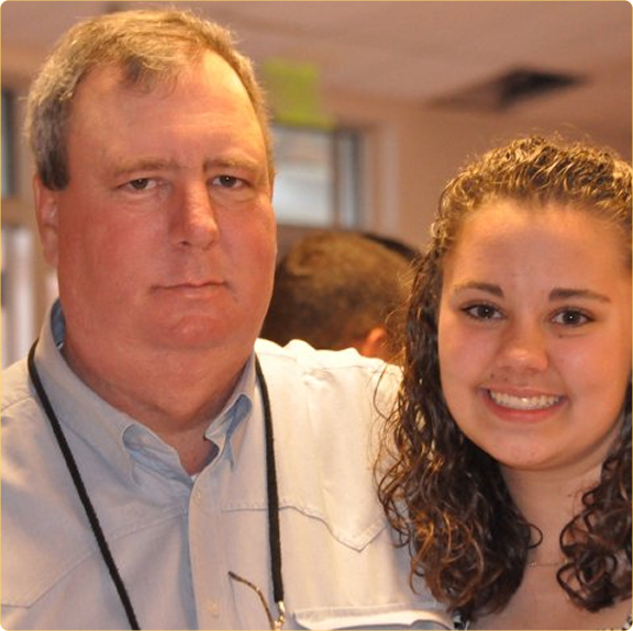Jeff Krehbiel and Brittany at her 8th grade graduation a milestone in Jeff's treatment