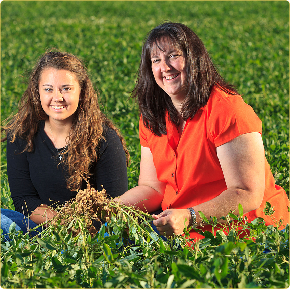 Karen Krehbiel and Brittany in field of peanuts Fall 2013